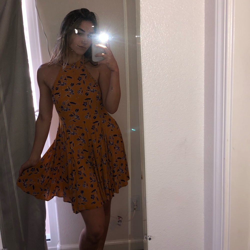 yellow high neck dress with purple flowers